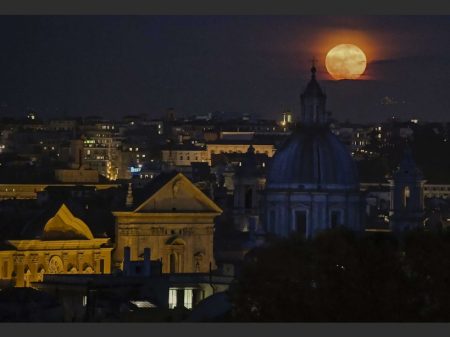 A full moon rises over the Rome's skyline, Monday, Nov. 14, 2016. Monday's supermoon, a phenomenon that happens when the moon is visible in full as it makes a close pass at the earth, is the closest to earth since 1948. (Alessandro Di Meo/ANSA via AP)/XDS101/16319625037060/ITALY OUT/1611141831