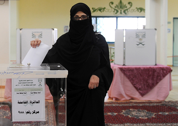 A Saudi woman casts her ballot at a polling station in the coastal city of Jeddah, on December 12, 2015, during municipal elections. Saudi women were allowed to vote in elections for the first time ever, in a tentative step towards easing widespread sex discrimination in the ultra-conservative Islamic kingdom. AFP PHOTO / STR / AFP / - (Photo credit should read -/AFP/Getty Images)
